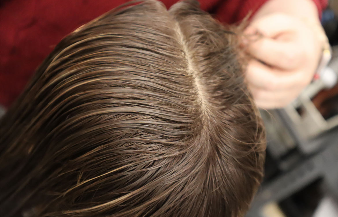 Brush-hair-either-side-of-part optimized